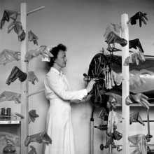 Photo credit: Lee Miller, US Army nurse drying sterilised rubber gloves Churchill Hospital Oxford England 1943 © Lee Miller Archives England 2022. All rights reserved. leemiller.co.uk